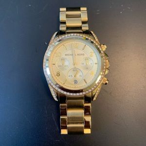 Woman’s Micheal Kors gold watch